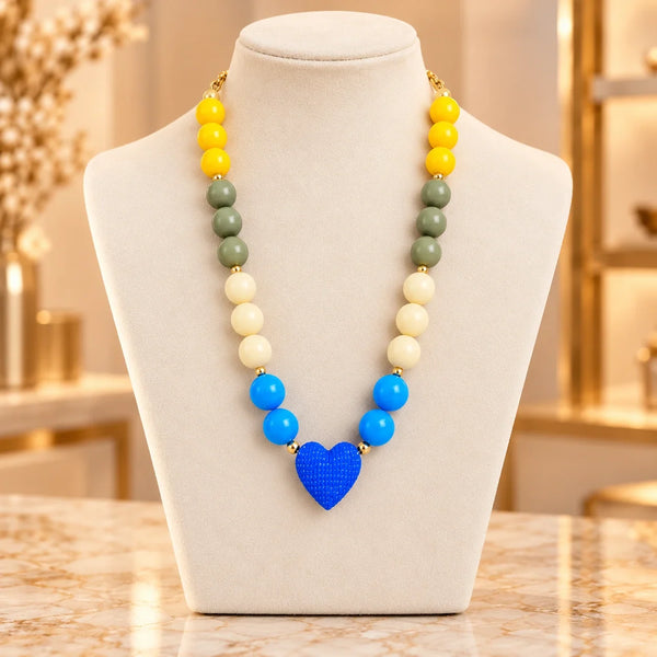 AA-C47 · Arcoíris & Corazón Azul · Exhibidor boutique